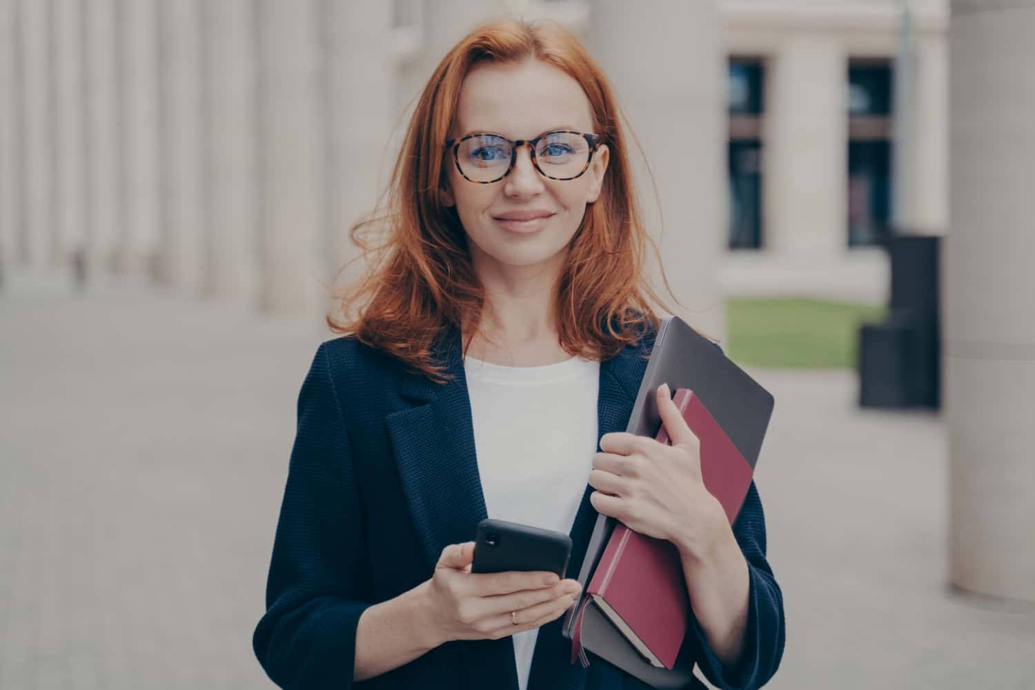 confident-beautiful-red-haired-female-business-con-2021-12-09-05-58-20-utc-min.jpg